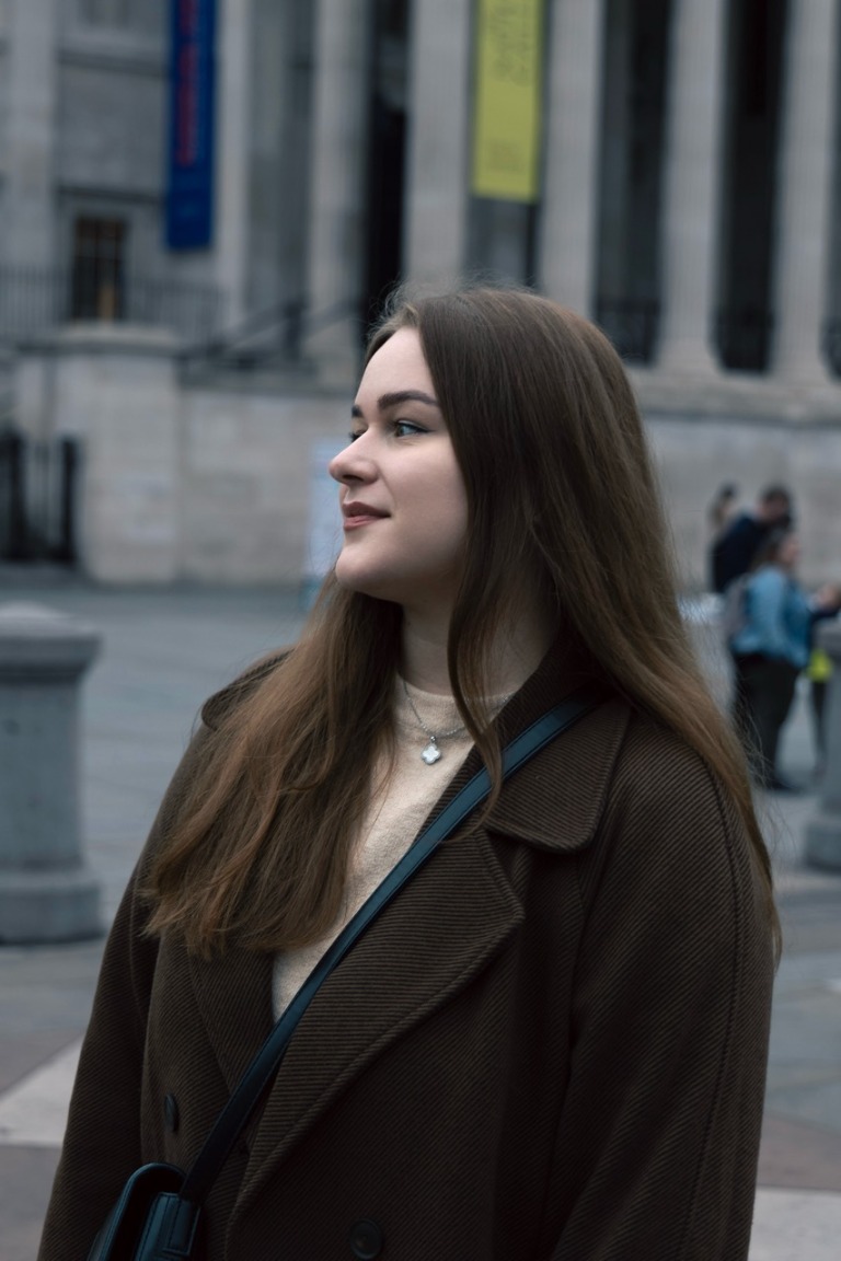 Portrait in profile against city architecture